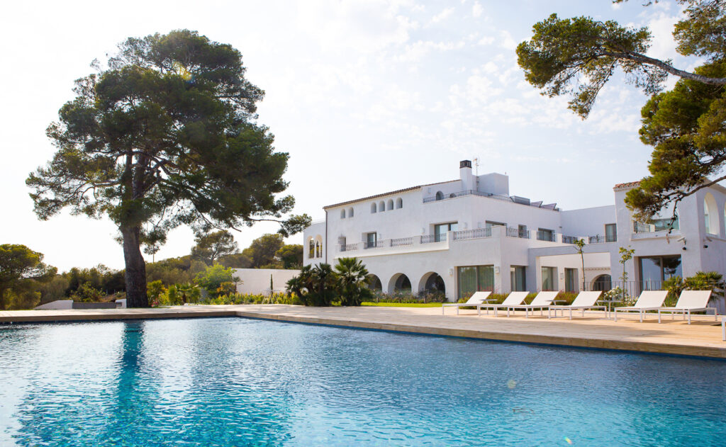 lounge chairs by the pool with sea views
